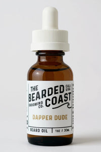 Bearded Coast Dapper Dude Beard Oil bottle with white dropper and sleek white label, 1 oz / 30 ml size