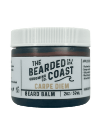 2oz jar of “Carpe Diem” beard balm by The Bearded Coast with white lid and bold branding.