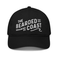 Black baseball cap with “The Bearded Coast Grooming Co.” embroidered in white on the front.