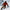 Snowboarder with a beard going down a snowy mountain