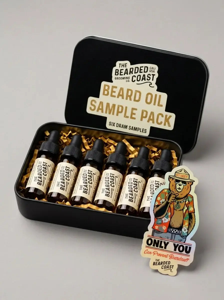Bearded Coast Beard Oil Sample Pack with six dram dropper bottles in open black tin with gold crinkle paper and "Only You Can Prevent Beardruff" holographic sticker — beard oil sampler gift set