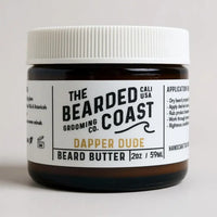 Bearded Coast Dapper Dude Beard Butter in amber jar with white lid and bold label, 2 oz / 59 ml size