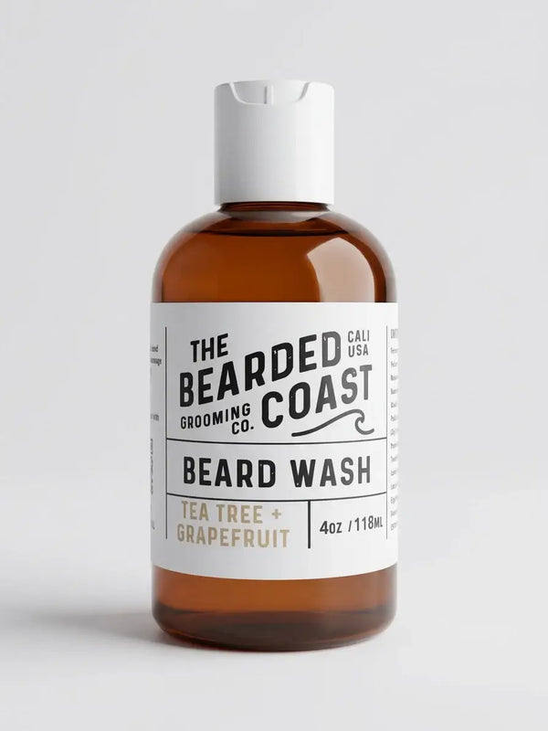 Bearded Coast True O.G. Unscented Beard Wash on marble countertop with folded towel and comb — sulfate-free beard wash for sensitive skin