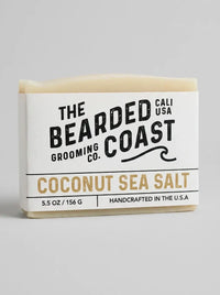 Bar of soap from The Bearded Grooming Co. with 'Coconut Sea Salt' flavor on a gray background
