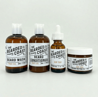 Bearded Coast Rip Tide Complete Beard Kit featuring four amber glass and plastic bottles — Beard Wash 4oz, Beard Conditioner 4oz, Unscented Beard Oil 1oz, and Beard Butter 2oz — with white labels on a clean light gray background