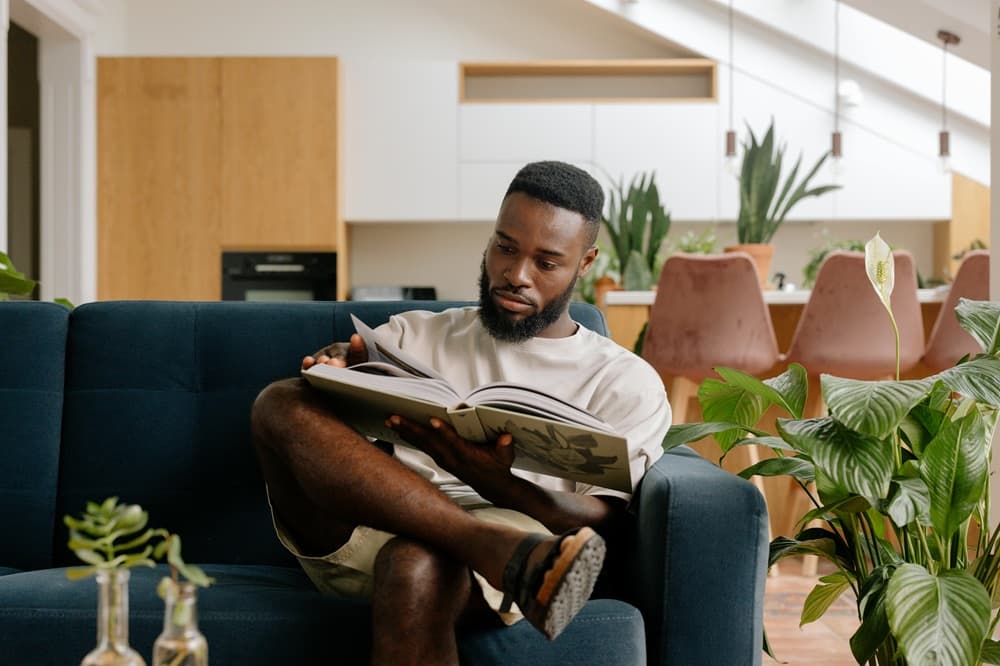 man siting reading a book
