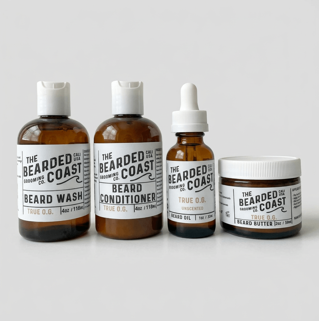 Bearded Coast True O.G. Complete Beard Kit featuring four amber glass and plastic bottles — Beard Wash 4oz, Beard Conditioner 4oz, Unscented Beard Oil 1oz, and Beard Butter 2oz — with white labels on a clean light gray background