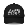 Black baseball cap with “The Bearded Coast Grooming Co.” embroidered in white on the front.
