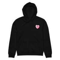 Abolish ICE candy heart all-gender organic mid-weight hoodie in black with pink heart design.