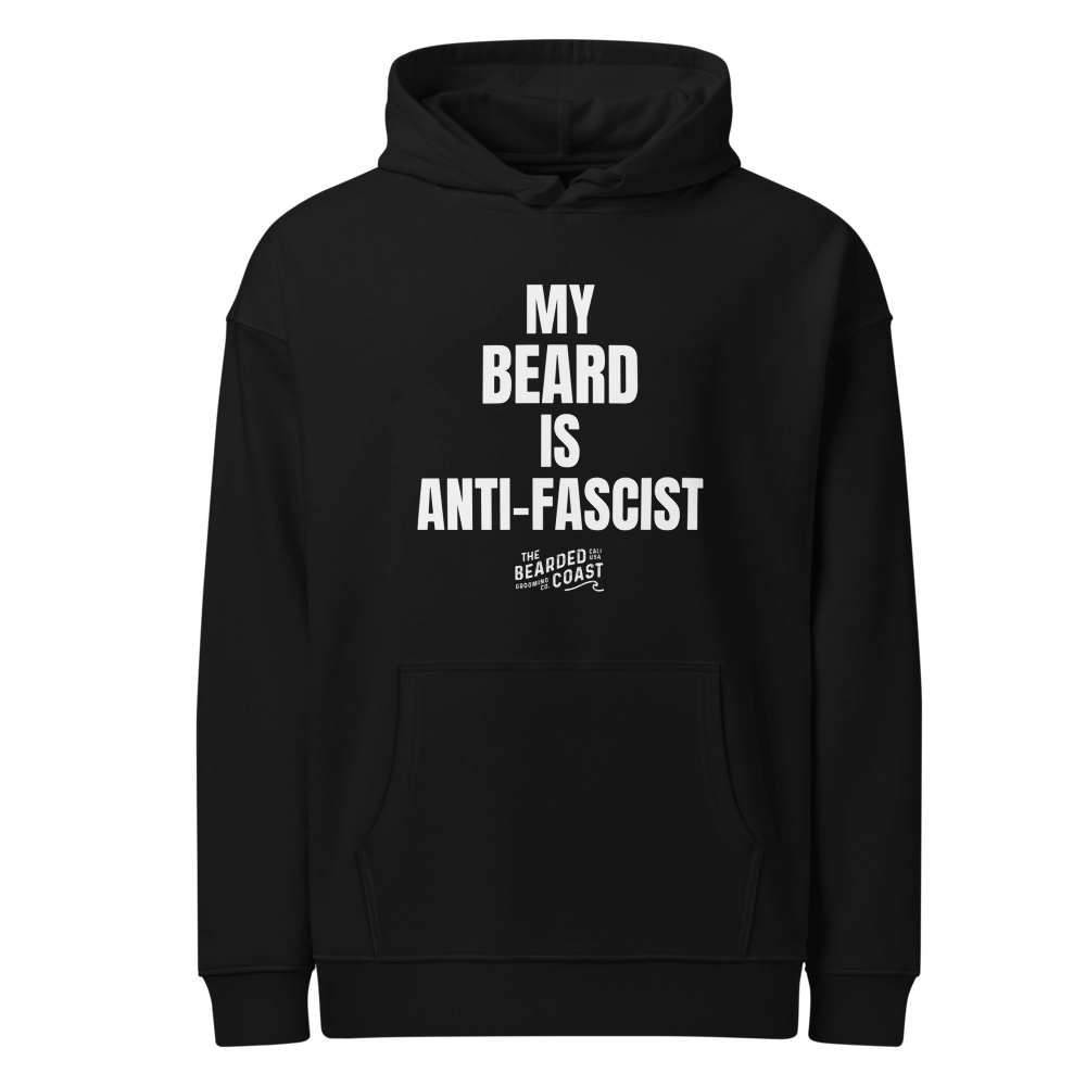Black hoodie with bold white text reading “MY BEARD IS ANTI-FASCIST” and Bearded Coast logo underneath.